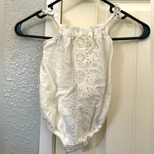 Cream colored body suit